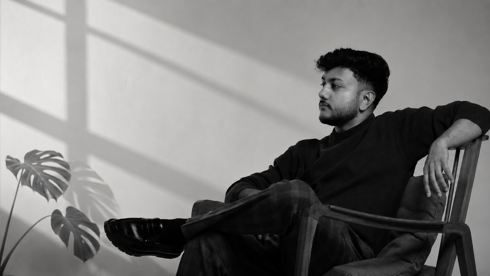 Tejas Patil, seated studio portrait